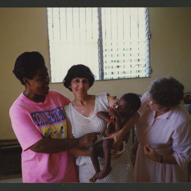 Three nuns pose for a photo with Odell at the hospital in Haiti.