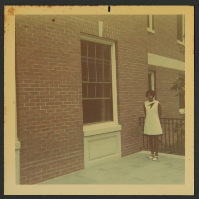 Venus Jones poses for a photo in front of a building on MWC's campus.
