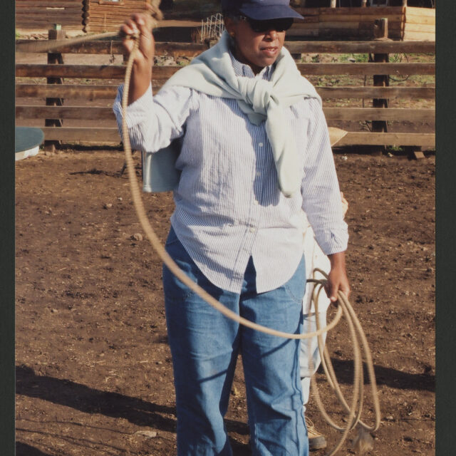 Venus Jones swings a lasso over her head.